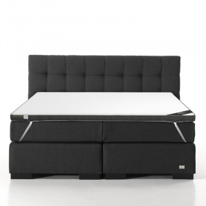 Een bed met daarop het Twin Motion® Topdekmatras.